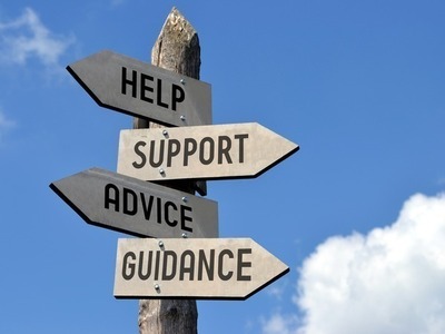 Signpost pointing to help, support, advice and guidance