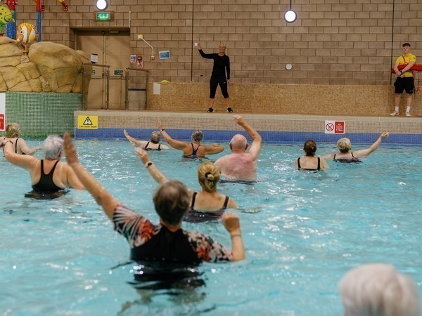 People doing an aerobics class in a swimming pool